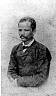  
Code: 0002 4061
Category: People from Elmina

Brother and sisters Coulon, Elmina
1. Pieter Vitringa Coulon

Pieter, Maria (ca. 1864-1953) and Johanna Vitringa Coulon were children of the Dutch colonial official Julius Vitringa Coulon (1824-1878), who served on the Gold Coast between 1853 and 1866, and Adjua Hogen from Elmina. At the time of Muller's visit, Pieter was registrar to the District Commissioner's Court at Elmina. Johanna has her daughter Mercy Hughes sitting on her lap. Descendants of the two women still live in Cape Coast and Elmina.
