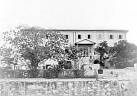  
Code: 0002 4039
Category: Views of Cape Coast

5. Government House, Cape Coast

It is likely that Hendrik Muller visited Cape Coast after he visited Elmina. Cape Coast is the former British Capital of the Gold Coast, situated circa 15 kilometres east of Elmina. All photo's of Cape Coast show views of the town and were most likely bought by him.

Government House was originally a merchant's house from circa 1840. Later, the British government on the Gold Coast acquired the building and converted into offices. At the time of Muller's visit it was a hospital. Recently, the building was completely restored and renamed as Heritage House. It is one of the important architectural landmarks in central Cape Coast.
