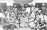  
Code: 0002 4037
Category: Images of the colonial Gold Coast

Chief Sakite of Manya Krobo with entourage 

Formal group portrait of paramount chief Sakite of Manya Krobo in what is today the Eastern Region of Ghana. He reigned from 1867 up to his death on 29 January 1892.

The photo shows a combination of traditional and colonial symbolic elements. On the one hand we see the umbrella and the staffs of office held by several persons, on the other the chain and medal, and the sword, which were received by the chief from the British colonial government. The necklace, badge and sword were presented to him by the British Governor for his merits in the 1873-74 Asante-war. The sword had an inscription stating 